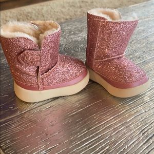 Never worn! Baby size 0/1 pink glitter Ugg’s.